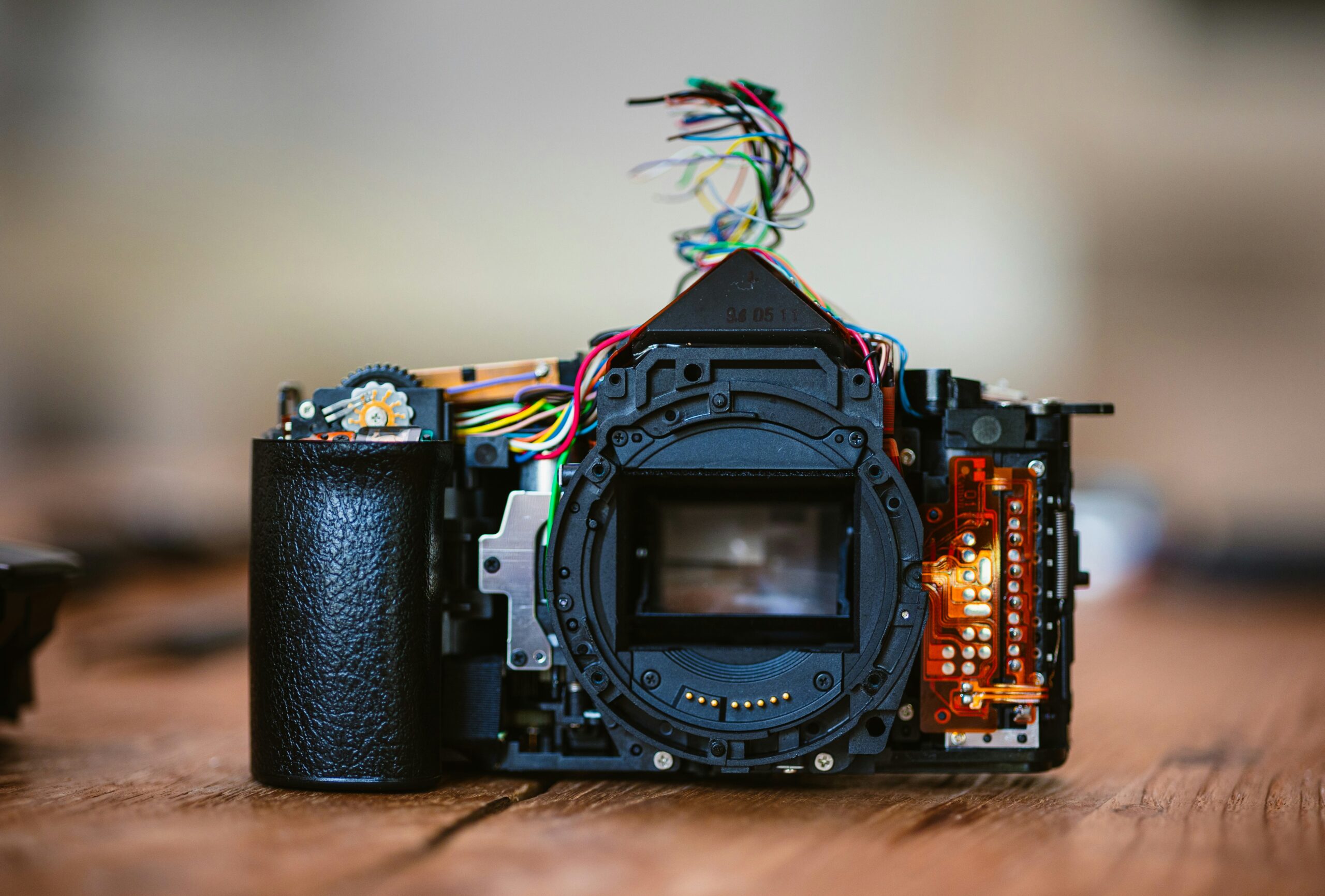 a camera sitting on top of a wooden table