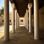 a row of white pillars sitting next to each other