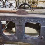 black metal tool on brown wooden table