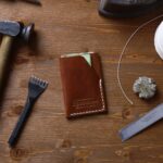 hammer beside brown book