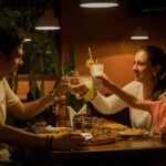 three people having a toast on table